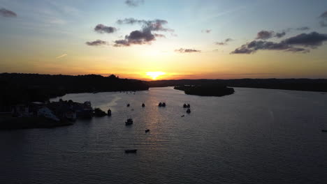 Aerial-view-around-boats-anchored-on-the-coastline-of-Brazil,-moody-sunset