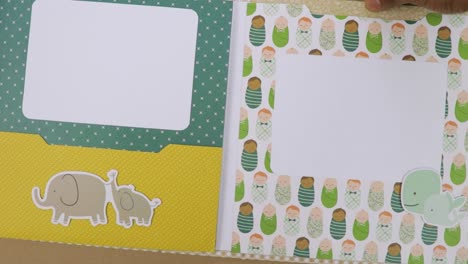 View-of-baby-themed-scrapbook-pages-with-cute-stickers-with-space-for-photograph