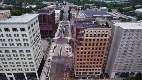 An-aerial-view-of-a-high-rise-building-demolition-in-downtown-Youngstown,-Ohio