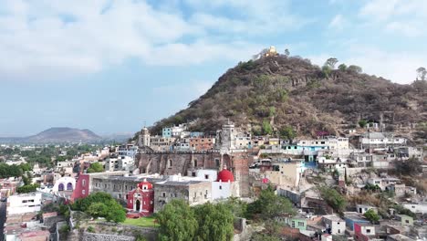 Low-altitude-drone-orbit-in-Atlixco,-Puebla-highlights-San-Miguel-Hill-and-Former-Convent-Of-San-Francisco