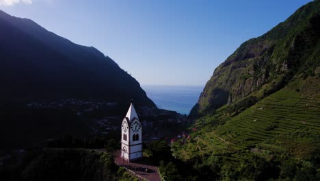 Flying-towards-historic-clock-tower-in-Madeira-island