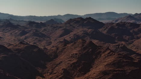 An-expansive-drone-shot-of-a-vast-mountain-desert-in-California