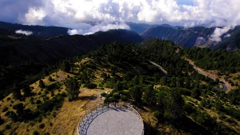 Aerial-view-of-people-watching-breathtaking-views-from-observation-deck-to-mountains-in-Madeira