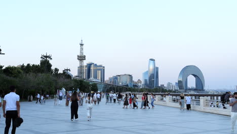 People-Enjoying-an-Evening-Walk-on-the-Boardwalk-in-Baku-around-Sunset