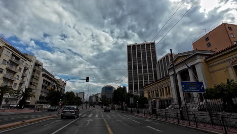 Drivers-view-of-cityscape-of-Athens-with-cumulus-clouds-on-sky-in-Greece