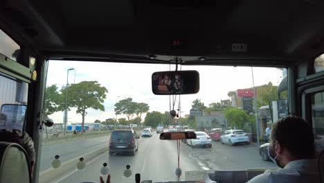 View-from-the-front-side-of-a-bus-transporting-people-through-the-streets-of-Istanbul,-Turkey