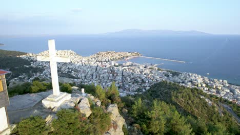 Kavala-City-Greece,-Aerial-Dolly-Shot,-Panoramic-view-of-Town-and-Cross-Monument-on-Mountain