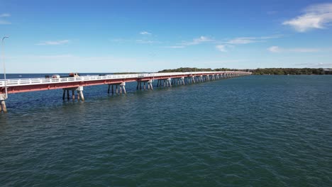 Bribie-Bridge-And-Seascape-In-Sandstone-Point,-Queensland,-Australia---Drone-Shot