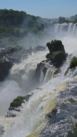 Argentina-Iguazu-Waterfall-Landscape,-Iguacu-Falls-Vertical-Video-for-Social-Media-Instagram-Reels-and-Tiktok-Scenery-of-Beautiful-Massive-Powerful-Waterfalls-in-Dramatic-Tropical-Scene