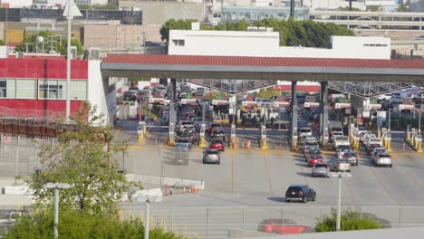 A-bustling-border-crossing-between-Mexico-and-the-United-States,-where-lines-of-vehicles-highlight-the-daily-movement-of-people-and-goods-across-international-boundaries