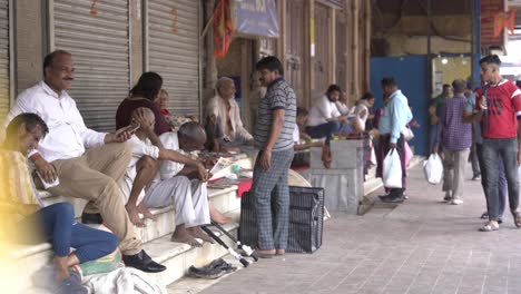 Elderly-Asian-people-sitting-streetside