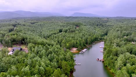 lakes-james-cove-aerial-push-in-toward-table-rock-mountain-in-north-carolina