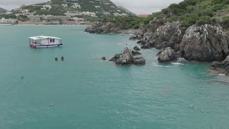 Moving-drone-shot-of-Pelican-Key-at-Saint-Martin-during-daytime