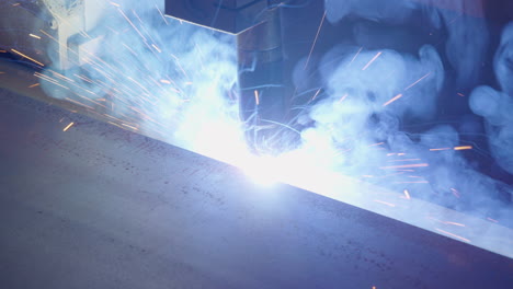 automatic-welding-robot-welding-metal-beams-slow-motion-close-shot