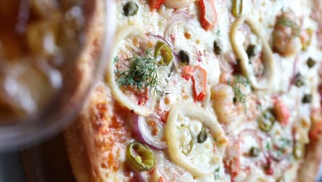 A-view-for-an-Italian-pizza-and-drink,-close-up-shot,vertical-video