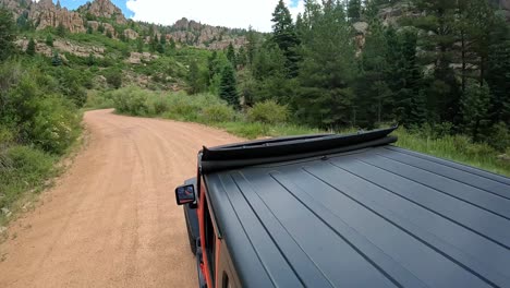 POV---View-of-vehicle-rooftop-driving-in-Phantom-Canyon-in-Colorado