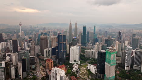 Tall-skyscrapers-of-Kuala-Lumpur-city-centre-in-Malaysia,-aerial-cityscape-view