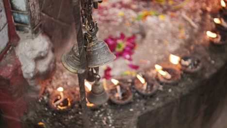 Candles-at-a-Buddhist-Temple-in-Bhaktapur-in-Nepal,-Close-Up-of-Prayer-Candles-for-Praying-in-the-Ancient-City-of-Bhaktapur,-used-in-a-Spiritual-and-Holy-Sacred-Place-of-Worship