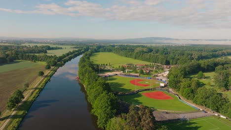 4K-Aerial-Drone-Footage-Of-Hluboka-Nad-Vltavou-Sport-Areal-and-Vltava-River,-Czechia,-Europe