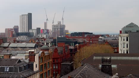 Wide-static-view-of-rooftops-and-skyline-of-cloudy-central-Manchester