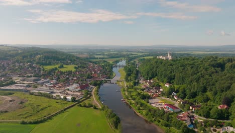 4K-Aerial-Drone-Footage-Of-Hluboka-Nad-Vltavou-Castle,-City-And-Vltava-River-In-Czechia,-Europe