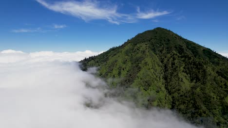 Aerial-view-of-mountains-above-the-clouds-in-Indonesia,-Gunung-Rante,-Ijen