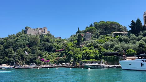 ancient-old-town-of-Portofino,-Italy-view-from-a-sailboat-moored-at-bay