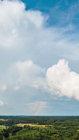 Vertical-aerial-countryside-hyperlapse-over-the-clouds