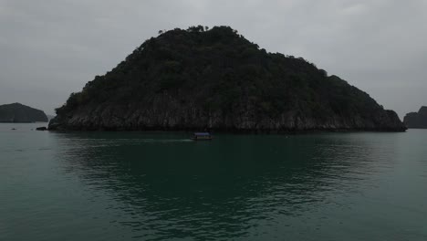 Boat-view-cruising-around-Ha-Long-Bay,-Lan-Ha-Bay-in-Vietnam-among-islands-of-Karst-Mountains-in-emerald-waters