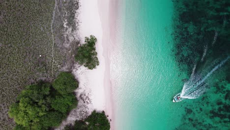 Explore-the-mesmerizing-beauty-of-Pink-Beach-in-Komodo-National-Park,-showcasing-its-unique-pink-sand-and-turquoise-waters-from-an-enchanting-perspective