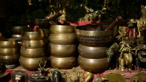 Tibetan-Singing-Bowl-in-Bhaktapur-in-Nepal,-For-Sale-in-a-Nepal-Market-at-a-Shop-at-a-Temple-at-Bhaktapur-Ancient-City,-used-in-Spiritual-Traditions-such-as-Meditation-Meditating-and-Relaxation