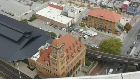 Zooming-down-over-Richmond's-iconic-landmark-Clock-Tower-as-well-its-nearby-highway