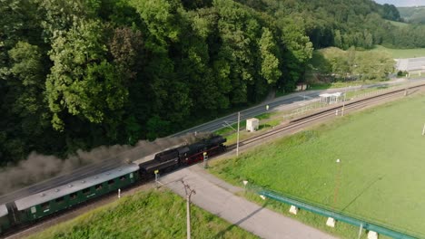 Steam-train-travels-through-the-natural-landscape-on-a-scenic-route-with-passengers-around-the-Pardubice-region-in-the-Czech-Republic