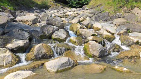 Water-flowing-in-the-river-Weesen,-Walensee,-Glarus,-Switzerland