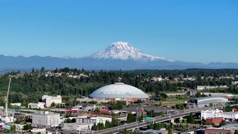 Tacoma-Dome-With-Downtown-Cityscape-and-Mount-Rainier-in-the-Background-in-Tacoma,-Washington,-USA---Drone-Flying-Forward