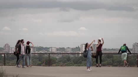 Tourists-taking-selfies-on-a-bridge-in-Belgrade,-Serbia