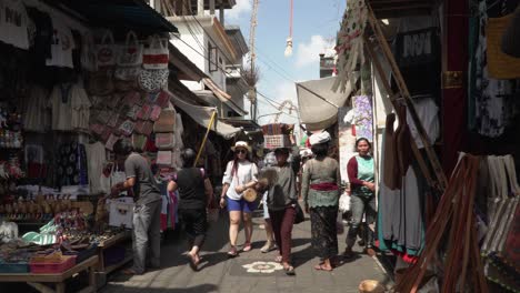 Locals-and-tourist-walking-through-a-small-market-area-in-Ubud,-Bali