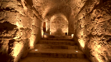 Stone-Path-Filled-With-Golden-Ambient-Light-With-Stairs-Leading-in-the-Upper-Floor-of-the-Ruins-of-Kerak-Crusaders-Castle