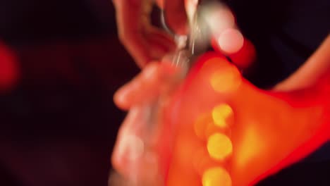 Close-shot-of-a-hand-playing-a-guitar-in-a-live-show