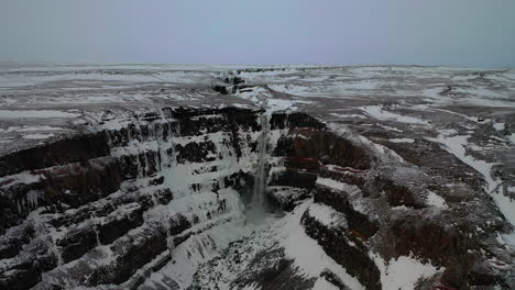 Flying-Towards-The-Second-Highest-Waterfall-In-Iceland---Hengifoss-Waterfall-In-East-Iceland---aerial-drone-shot