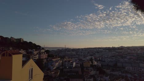 Panning-shot-of-Lisbon,-Portugal,-landscape-from-above,-during-sunset