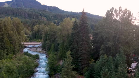 Aerial-rise-over-river-rapids-adjecent-to-fall-out-river-where-its-dry-due-to-low-levels-of-water-from-icebergs-melting-on-a-summer-afternoon