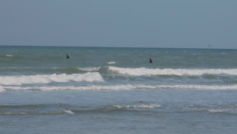 Two-surfers-waiting-for-wave