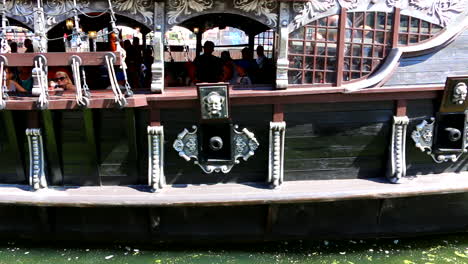 Close-up-shot-of-the-exterior-of-the-pirate-boat-with-tourists