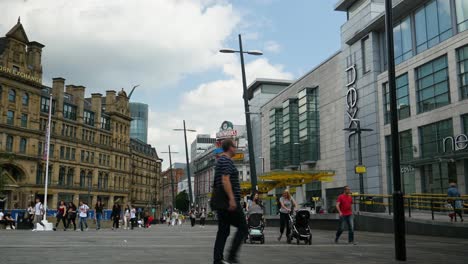 Printworks-and-Arndale-centre-area-tourist-attraction-public-modern-park-in-Manchester-City-Greater-Manchester-Summer-sunny-day-with-pedestrians-people-walking-in-frame-landmark-4K-25p