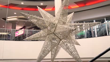 The-camera-pans-down-an-escalator-revealing-an-empty-mall-during-the-festive-season