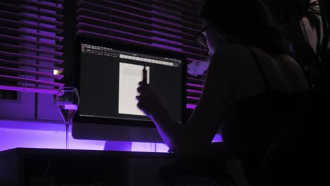 Slow-Motion-of-a-Young-Woman-Smoking-Electronic-Cigarette-and-Wine-Alcohol-Drink-on-Table-in-Front-of-Computer-at-Night