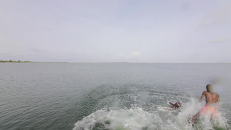 Excited-african-black-kids-diving-into-ocean-waters-fearlessly-Senegal