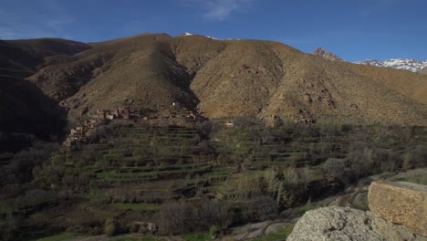 Aerial-wide-shot-of-Moroccan-Mountain-landscape-during-beautiful-sunny-day-with-blue-sky