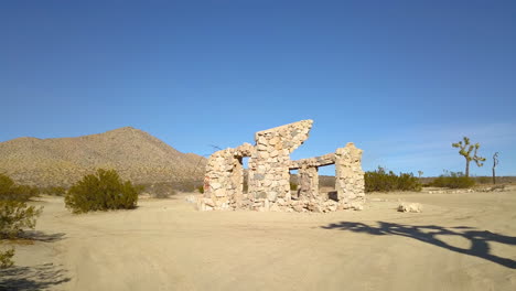 Beautiful-desert-landscape-with-ruined-house-on-sunny-day